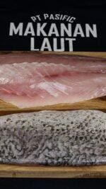 Barramundi fillet Bali on wooden board – skin-on and skinless cuts