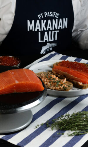 smoked salmon, red caviar and salmon spread set on a plate