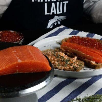 smoked salmon, red caviar and salmon spread set on a plate