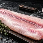 buy grouper fillet bali – whole fresh grouper fillet on wooden board with cleaver