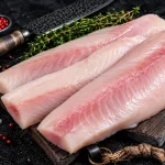 buy mahi-mahi fillet bali – fresh mahi-mahi fillets on wooden board with thyme