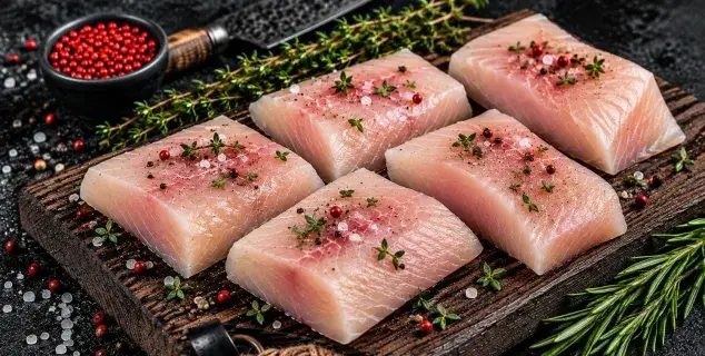 mahi-mahi steaks bali – fresh mahi-mahi portion steaks with thyme and pepper