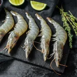 prawn tiger bali – raw prawns with lime and herbs on slate