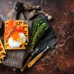 caviar delivery bali – waffle with cream cheese, smoked salmon, egg and red caviar