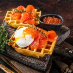 red caviar bali – waffle with smoked salmon, poached egg and salmon roe