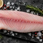 red snapper fillet bali – fresh skinless snapper fillet on ice with lemon and rosemary