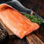 salmon fillet bali – salmon fillet on wooden board with herbs and salt