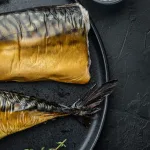 Smoked mackerel Bali — hot-smoked mackerel fillets served on a black plate