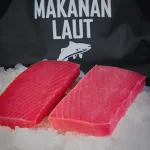 Tuna saku Bali — two sashimi-grade tuna saku blocks on crushed ice, PT Pasific Makanan Laut