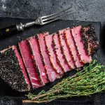 sashimi grade tuna bali – rare tuna steak slices with fresh herbs