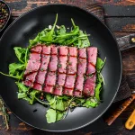 tuna steak bali delivery – seared tuna steak salad with arugula and spinach