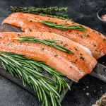 salmon bali – salmon fillet with spices and herbs on dark wood