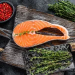 salmon steak bali – raw salmon steak with herbs and red pepper